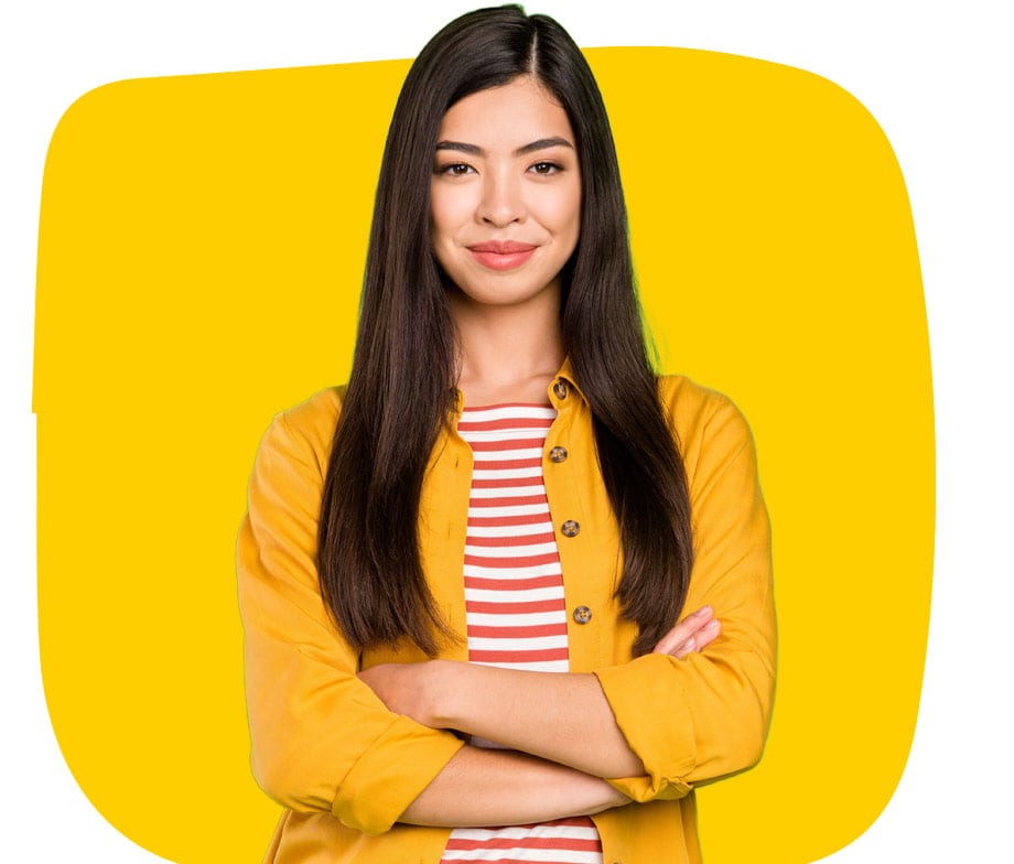 Asian translation services expert smiling with folded arms on yellow background