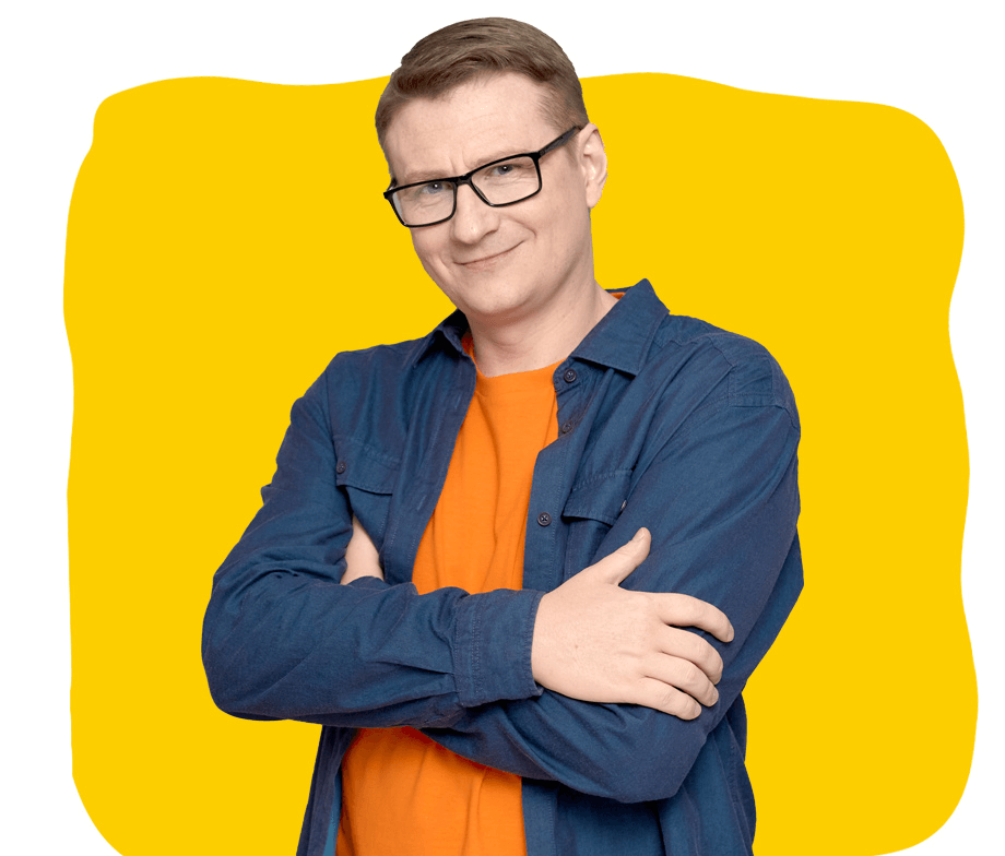 Belgian French Transcription services UK, A middle-aged man wearing glasses and a blue shirt, with folded arms and a smiling.