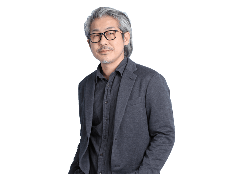 Chinese translation services professional wearing a dark grey jacket and standing