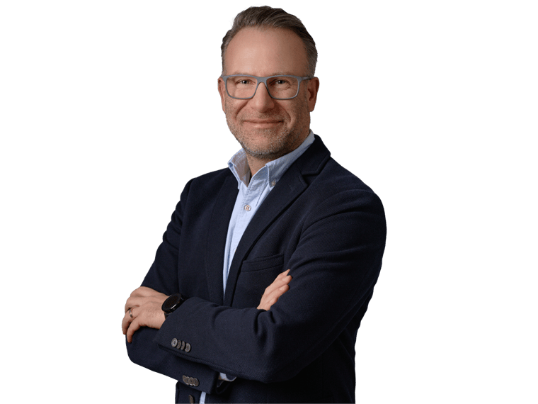 Financial translation services, Smiling mature businessman in glasses, wearing suit without a tie, standing against grey background 