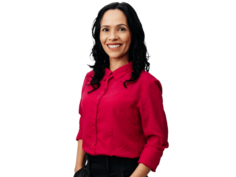 Legal Interpreting services UK, A young woman wearing a red shirt, smiling with her hands tucked into her pockets.