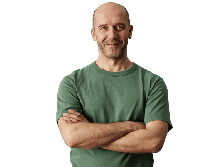 Luxembourgish translation services, Minimal waist up portrait of mature bald man smiling at camera while standing confidently with arms crossed