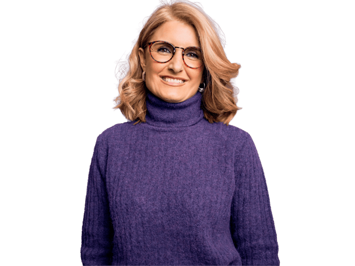 Macedonian translation services,Middle age beautiful blonde woman wearing casual purple turtleneck sweater and glasses