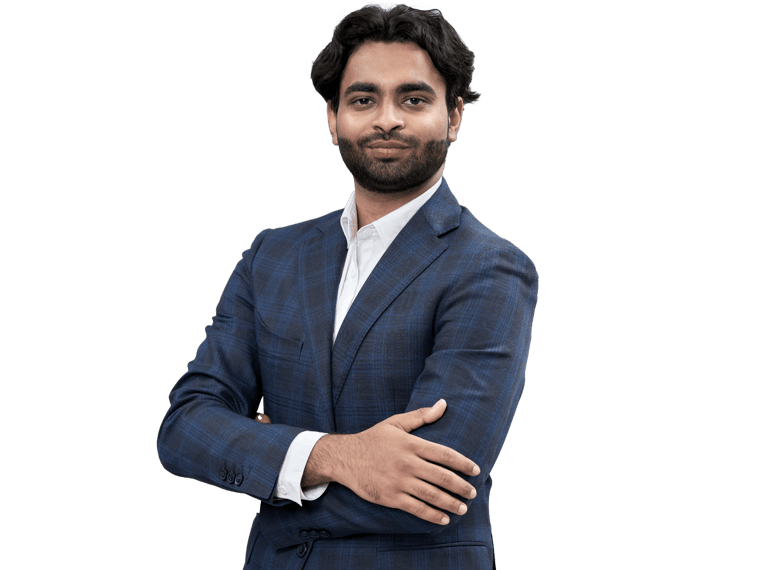 Professional Punjabi translation services Uk, Indian man standing with arms folded, looking confidently at the camera.