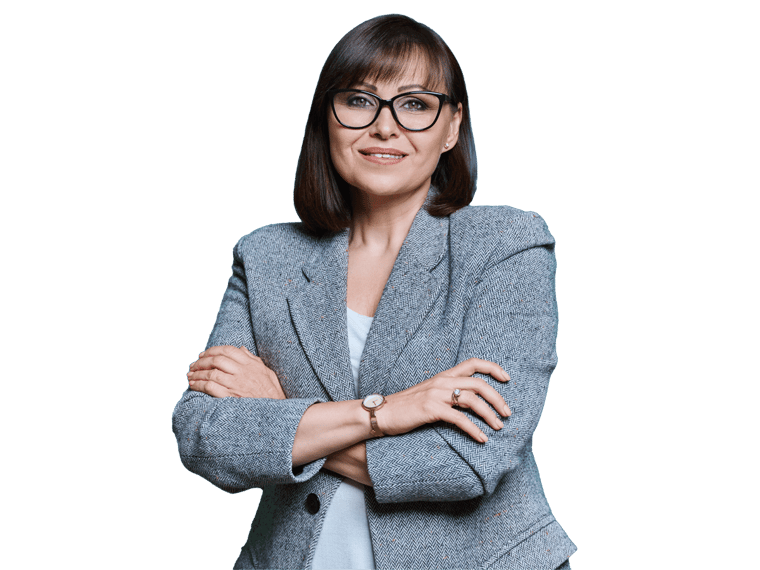 Turkish translation services professional woman  with arms crossed, wearing glasses and a suit.