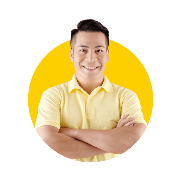 Professional manufacturing translation services by Absolute translations, Portrait of smiling young Asian man standing with arms crossed against brown background.