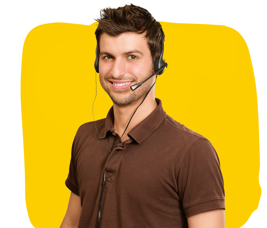 Greek Interpreting services, A middle-aged interpreter, dressed in a T-shirt and wearing a headset, talking to a client.