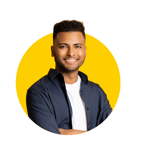 Professional Kannada translation services by Absolute Translations, confident young Indian man standing with arms crossed and looking at the camera.