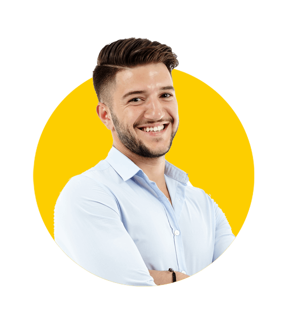 Maltese translation services by Absolute Translations, full-length portrait of young Caucasian businessman with arms folded.