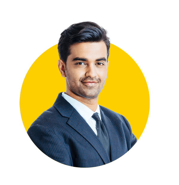 Marathi translation services by Absolute Translations, confident smiling businessman with arms crossed.