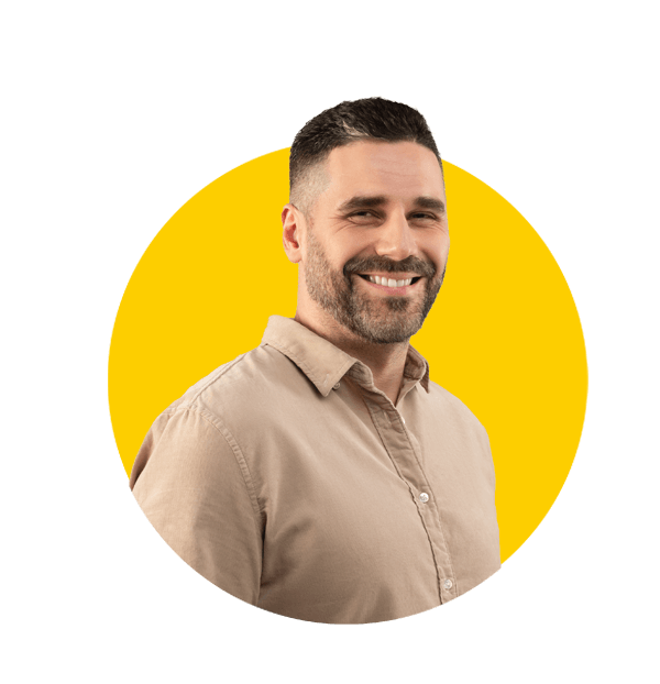 Pashto translation services by Absolute Translations, successful middle-aged male entrepreneur in shirt smiling at camera