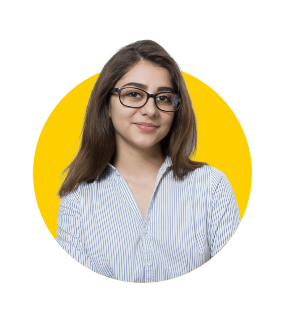 Tamil translation services by Absolute Translations, attractive young brunette woman wearing glasses and a light business shirt.