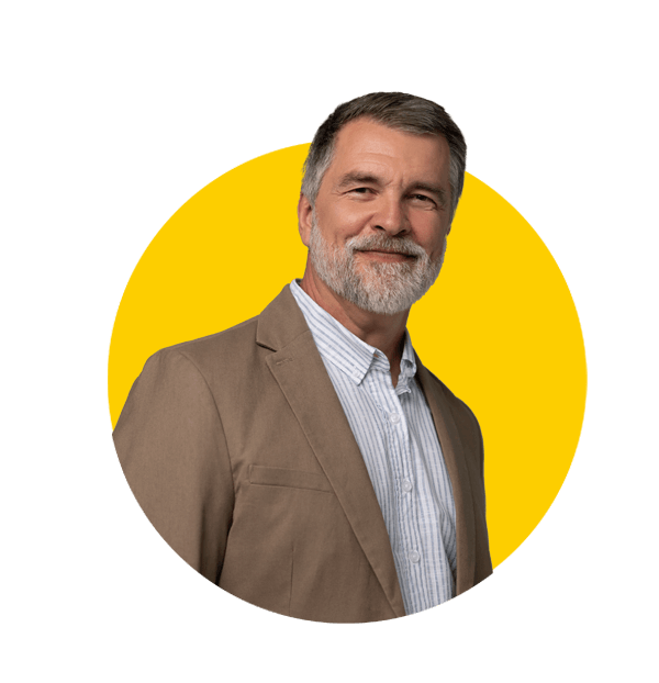 Turkish translation services by Absolute Translations, confident businessman in stylish jacket smiling in professional portrait.