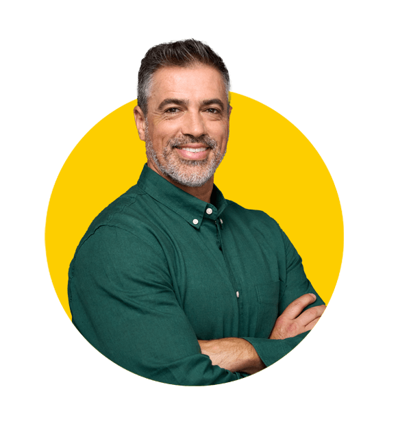 Urdu translation services by Absolute Translations, happy middle-aged businessman and entrepreneur smiling confidently.