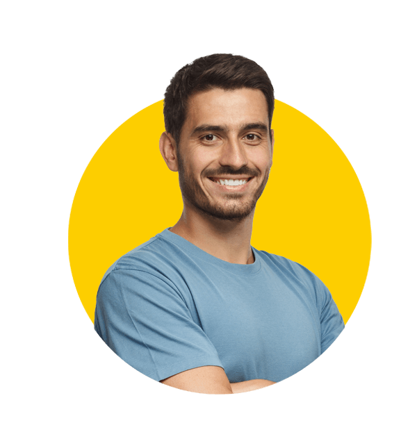 Welsh translation services by Absolute Translations, portrait of attractive young sporty man in blue t-shirt standing with crossed arms on gray background.