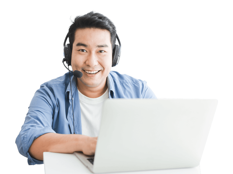Tagalog interpreting services man wearing headphones and a headset sits at a desk with a laptop