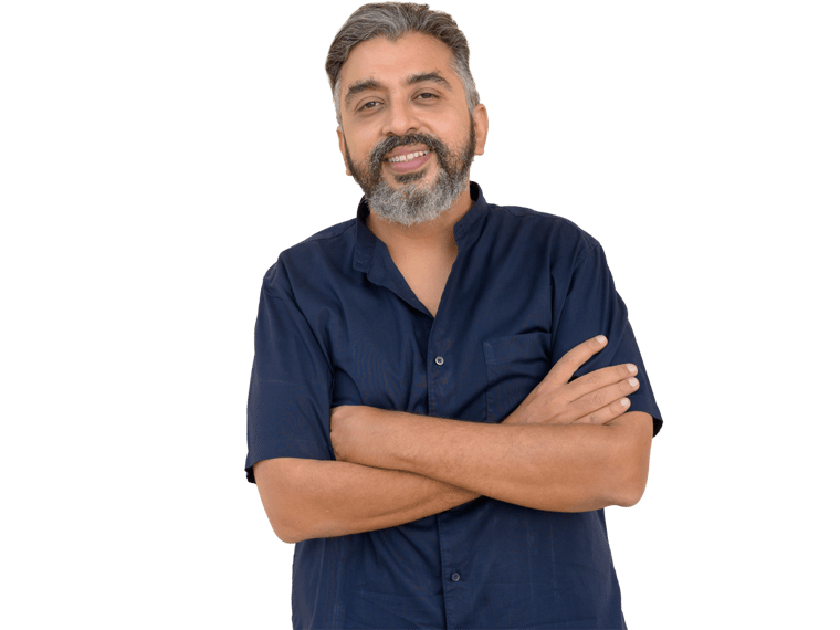 Tamil translation services, Portrait of handsome bearded Indian businessman against plain background