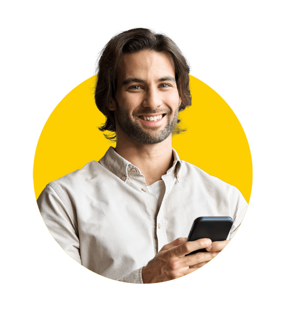 Urgent translation services by Absolute translations, Young happy business man entrepreneur holding mobile cell phone standing in office