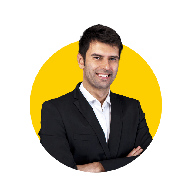 Sinhalese translation services by Absolute Translations, young handsome man in black suit smiling on dark background.