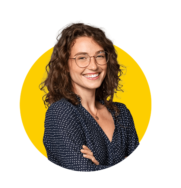 Romanian translation services by Absolute translations, Confident young woman wearing eyeglasses and standing on gray wall.