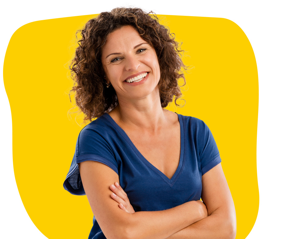 Albanian transcriber expert smiling with crossed arms wearing a blue shirt