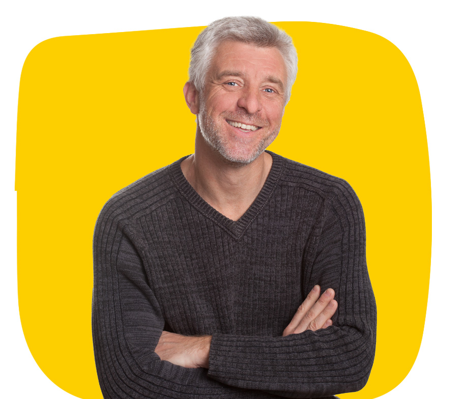 Czech transcription service specialist smiling wearing a grey jumper with folded arms