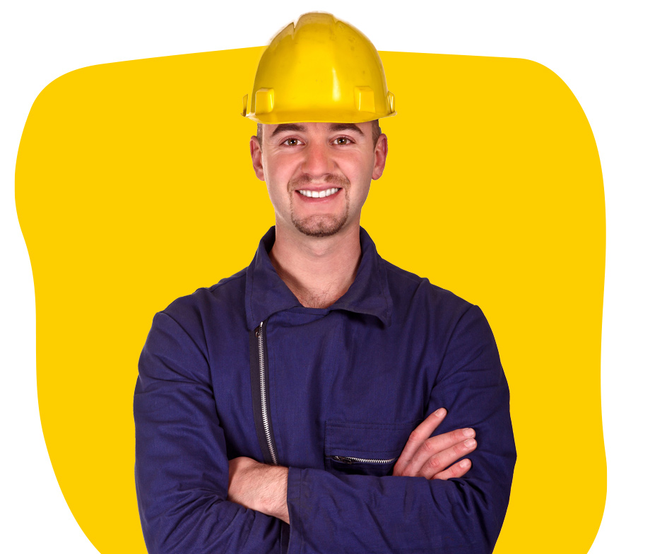 Dutch technical translator wearing yellow helmet and smiling with folded arms