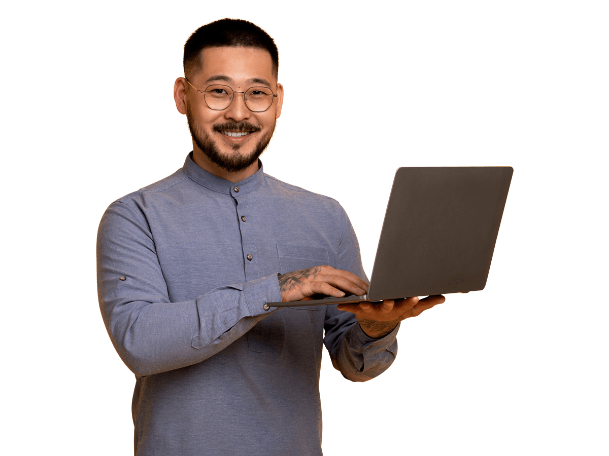 Japanese website translation services smiling man holding a laptop