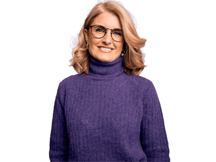 Macedonian transcription services, Middle age beautiful blonde woman wearing casual purple turtleneck sweater and glasses 