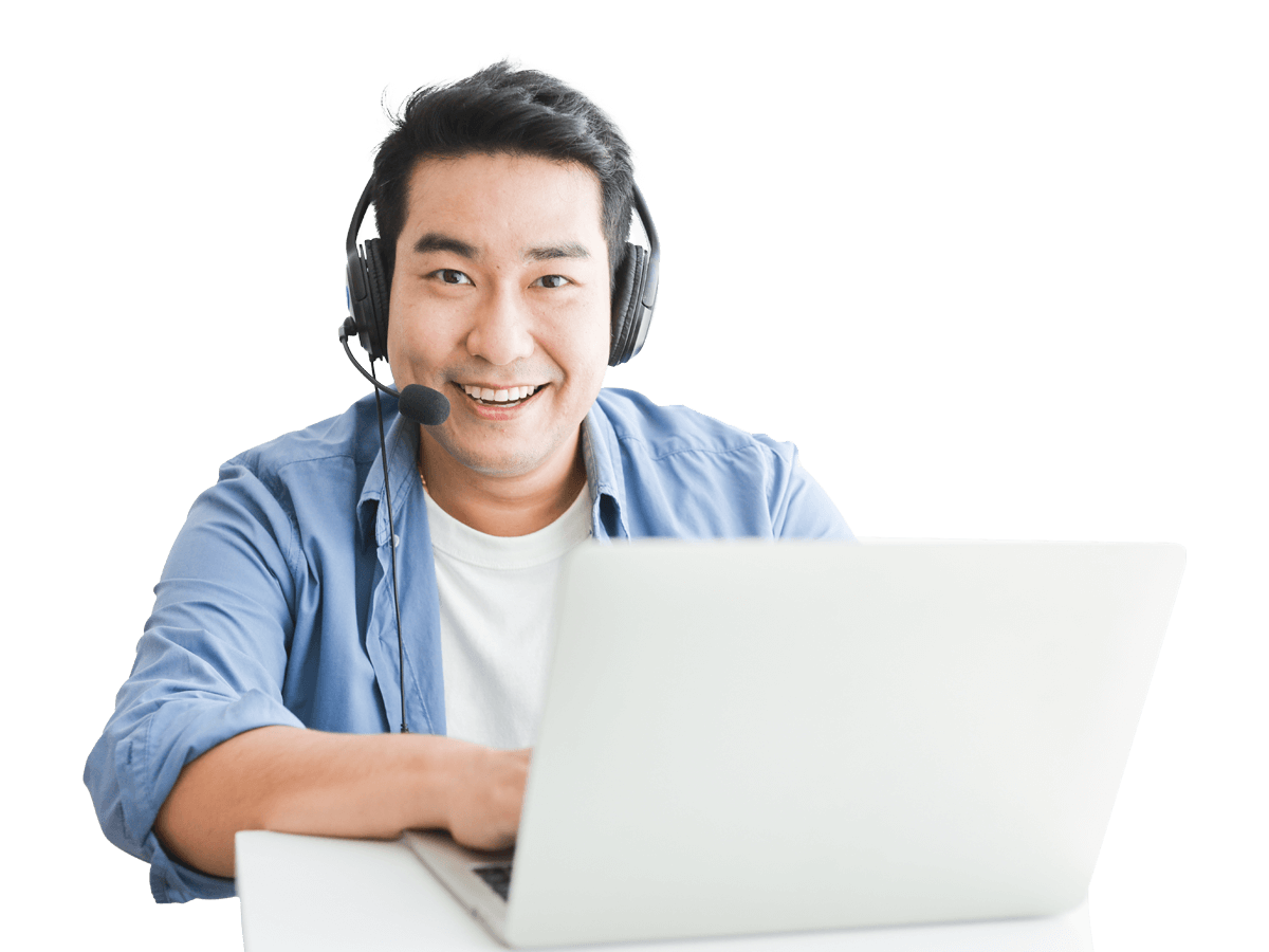 Tagalog interpreting services man wearing headphones and a headset sits at a desk with a laptop