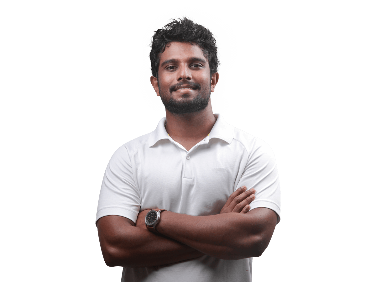Tamil interpreting services confident man in a white shirt standing with arms crossed.
