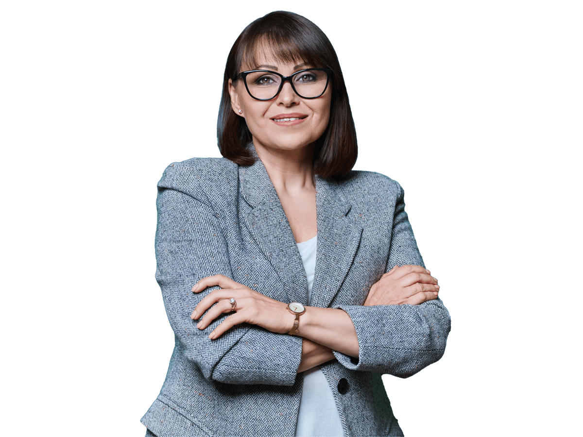 Turkish translation services professional woman  with arms crossed, wearing glasses and a suit.