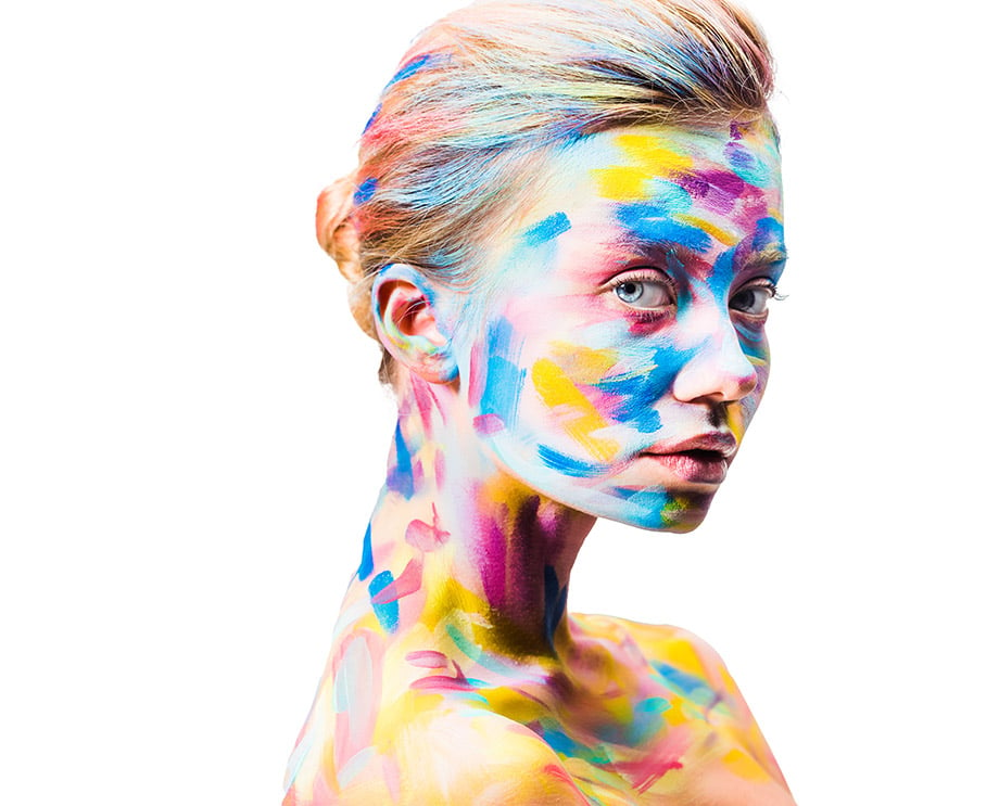 creative translation company symbolized by young lady with colorful bright body art looking at camera